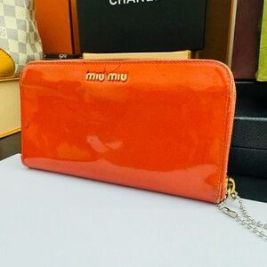 Miu Miu Patent Leather Zippy Long Red Wallet. Serial number: 12